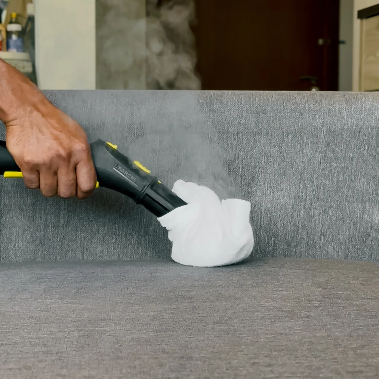 Professional sofa cleaning with industrial equipment